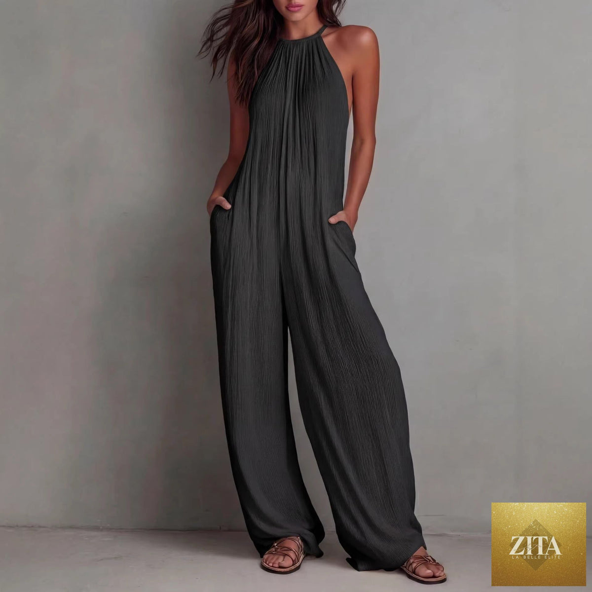 Women's sleeveless open-back wide-leg pleated jumpsuit by Zita La Belle Elite, showcasing casualwear style and flowing fabric.
