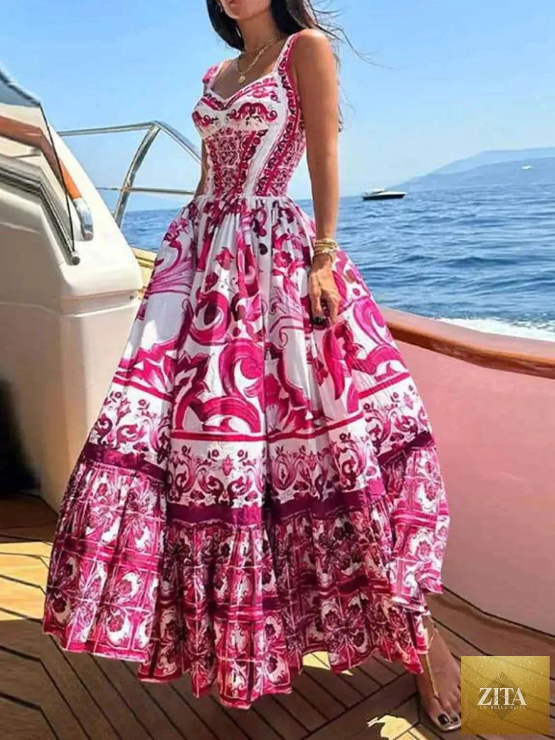 Smocked printed wide strap dress by Shopiebay featuring a flowy silhouette and vibrant floral pattern.