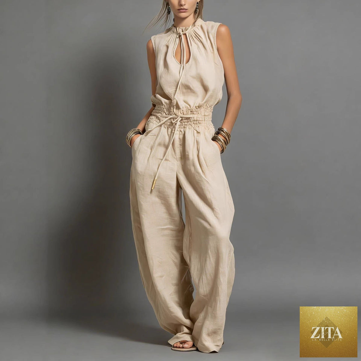 Women's sleeveless high-waist wide-leg pleated jumpsuit by FitiqueFit, casualwear style, shown in beige with pleated details.