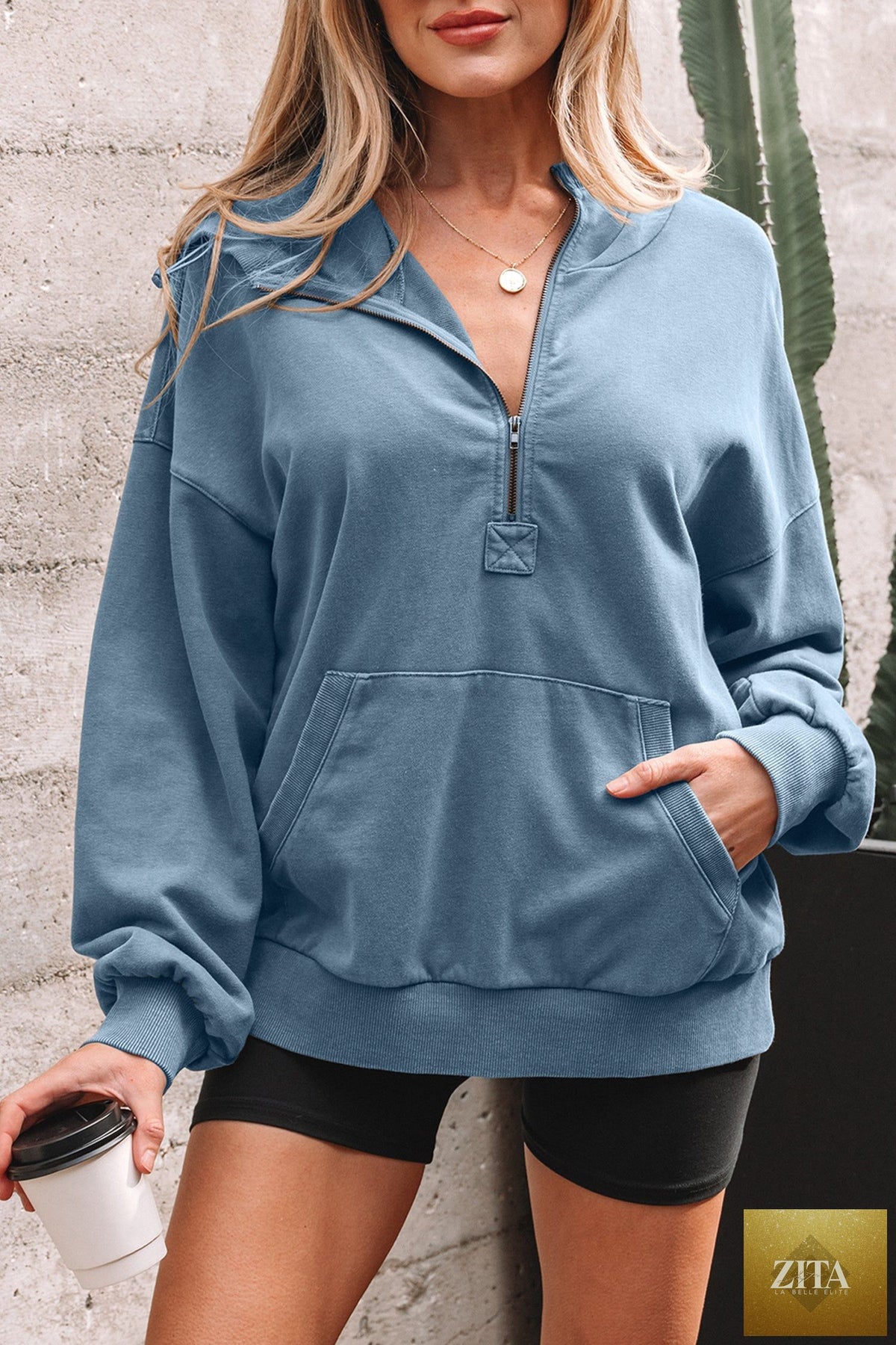 Black half-zip kangaroo pocket mineral wash hoodie from Wild and Free Boutique, featuring a relaxed baggy fit and casual style.