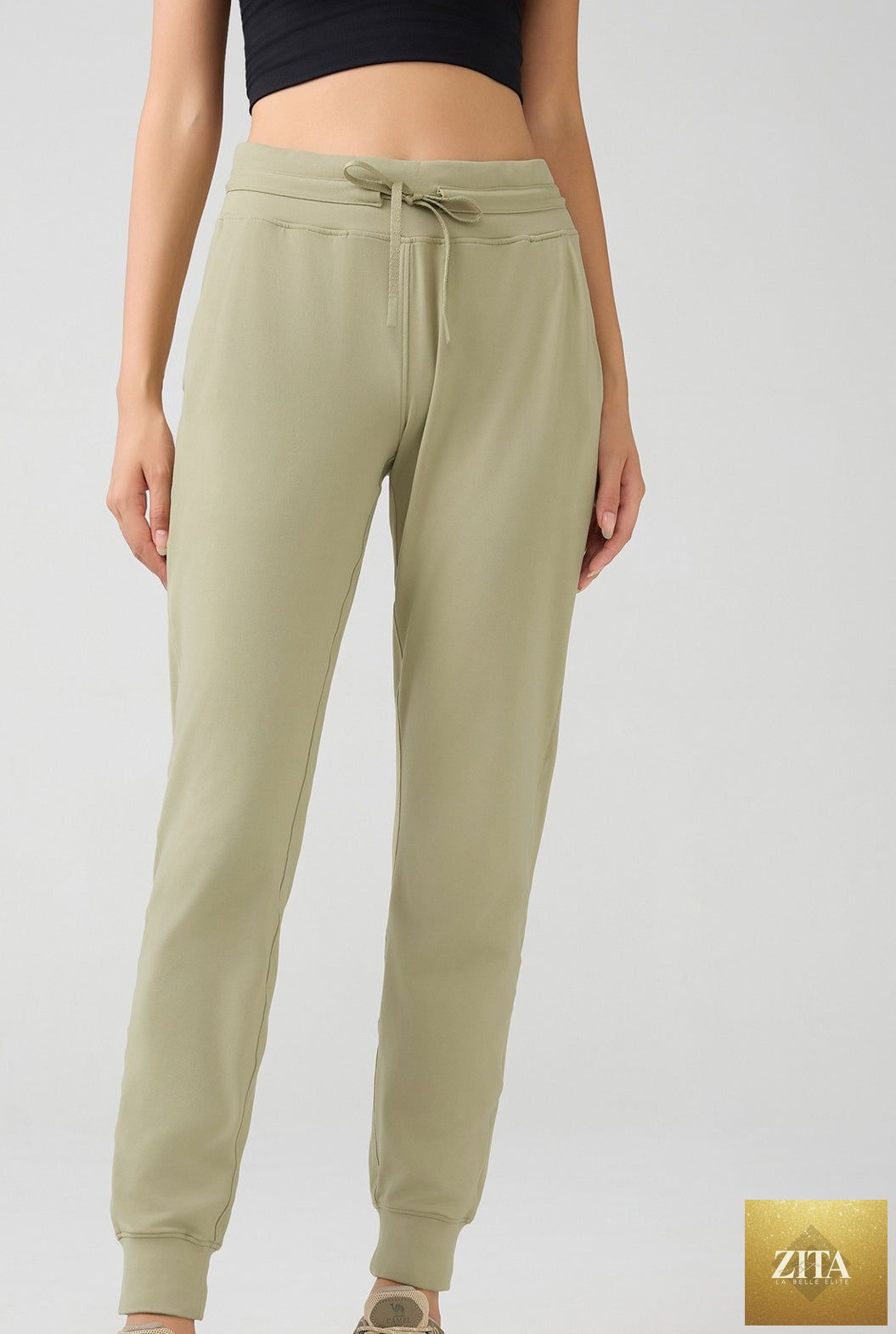 Women’s high waist tapered fitness leggings by SHOMICOBOUTIQUE, showing a close-up of the black, form-fitting workout leggings.
