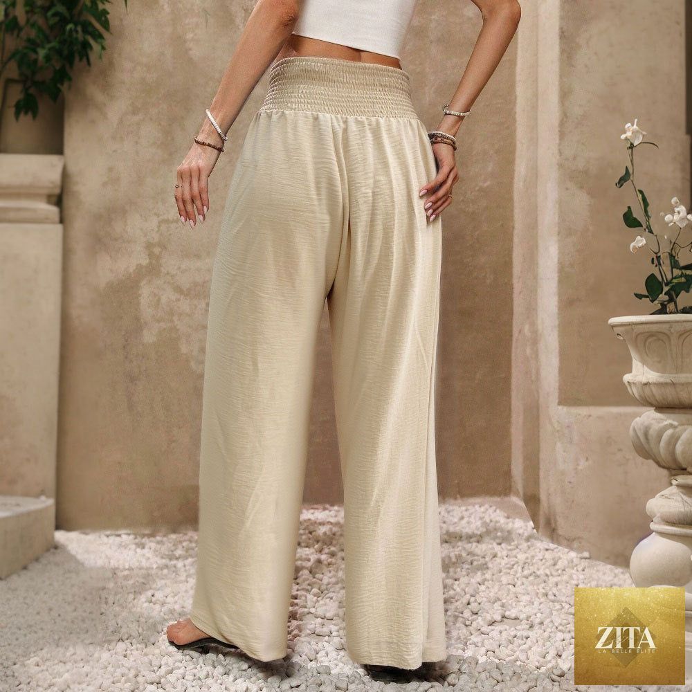 Women's solid-color high-waist tie-front casual wide-leg pants with a drapey fit, shown in a natural fabric and relaxed style.