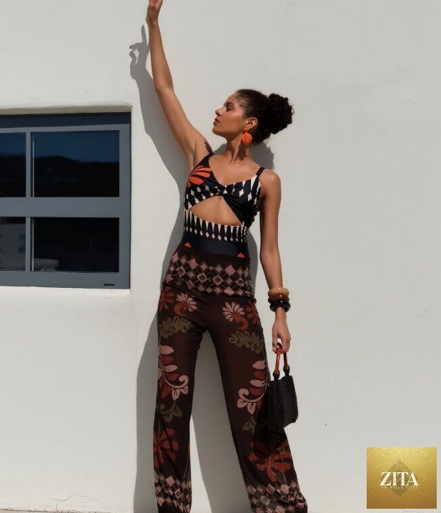 Women's Zita La Belle Elite two-piece swimsuit set with sleeveless top and wide-leg pants, shown on a model.
