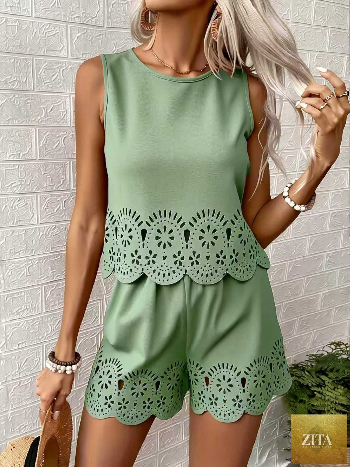 Women's elegant hollow-out floral top and pants set by Zita La Belle Elite, featuring a stylish casualwear look with intricate floral details.