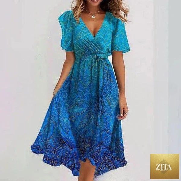Floral print FitiqueFit A-line dress with V-neck, short sleeves, and midi length, featuring a vibrant floral pattern.