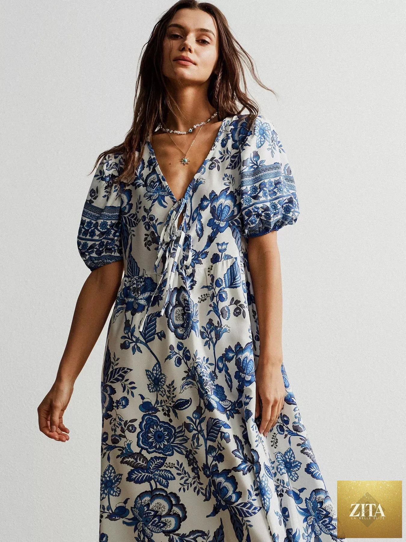 Floral print tie-neck puff sleeve maxi dress by Shopiebay, featuring a flowy silhouette and vibrant floral pattern.