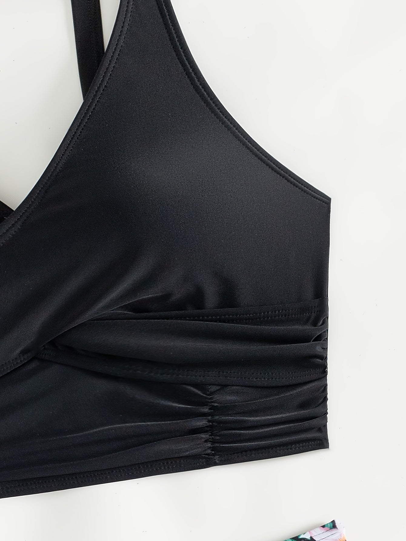 Black solid bikini set by Stevvex featuring twist front, high waist, V-neck, ruched tummy control, and cross strap, quick-drying swimwear.