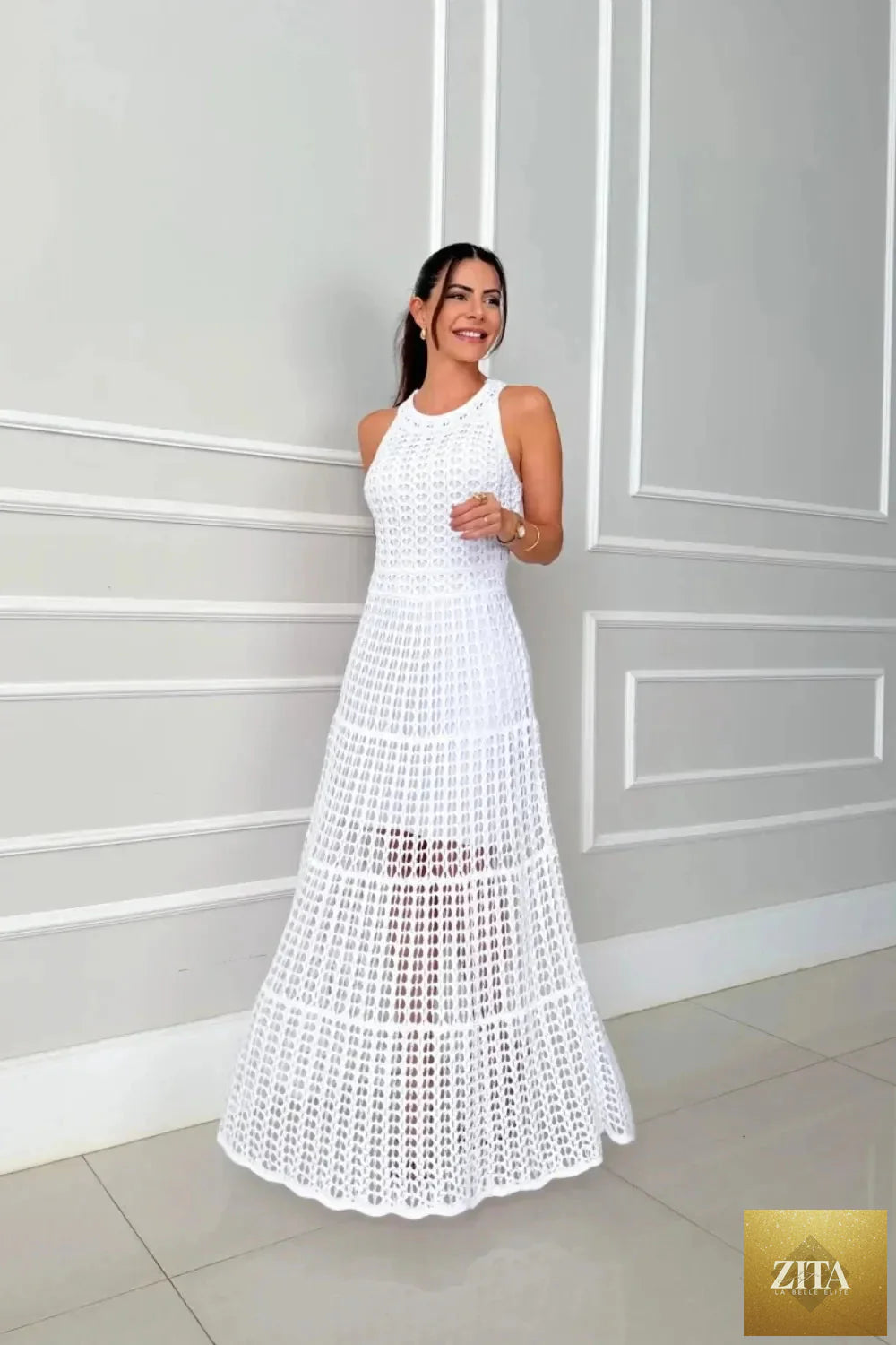 Hollowed-out sleeveless maxi dress by Shopiebay featuring a flowing design and stylish cut-out details.