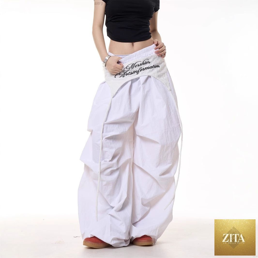 Women's relaxed casual cargo pants with layered design and tie details, featuring American-style styling and comfortable fit.