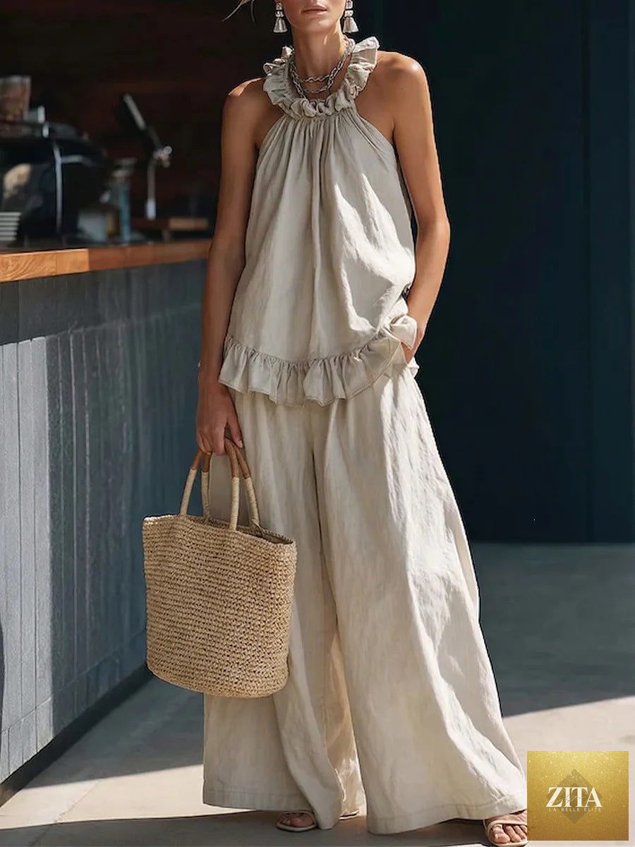 Zita La Belle Elite halterneck loose two-piece casualwear set with pleated design and asymmetric pockets, shown on a model.