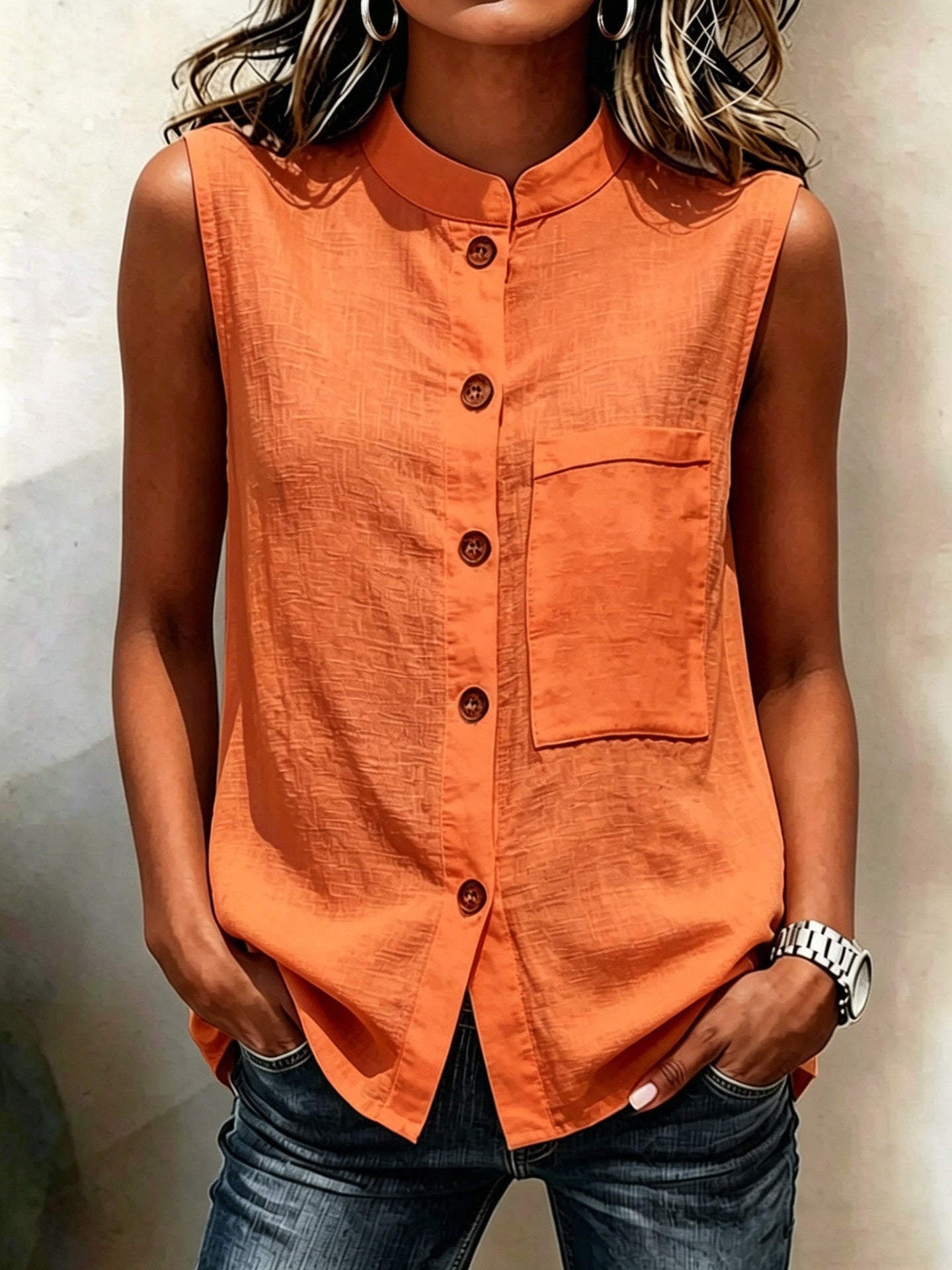 Women's sleeveless crop top with buttoned pockets in solid color, casualwear by FitiqueFit, shown in a relaxed fit.