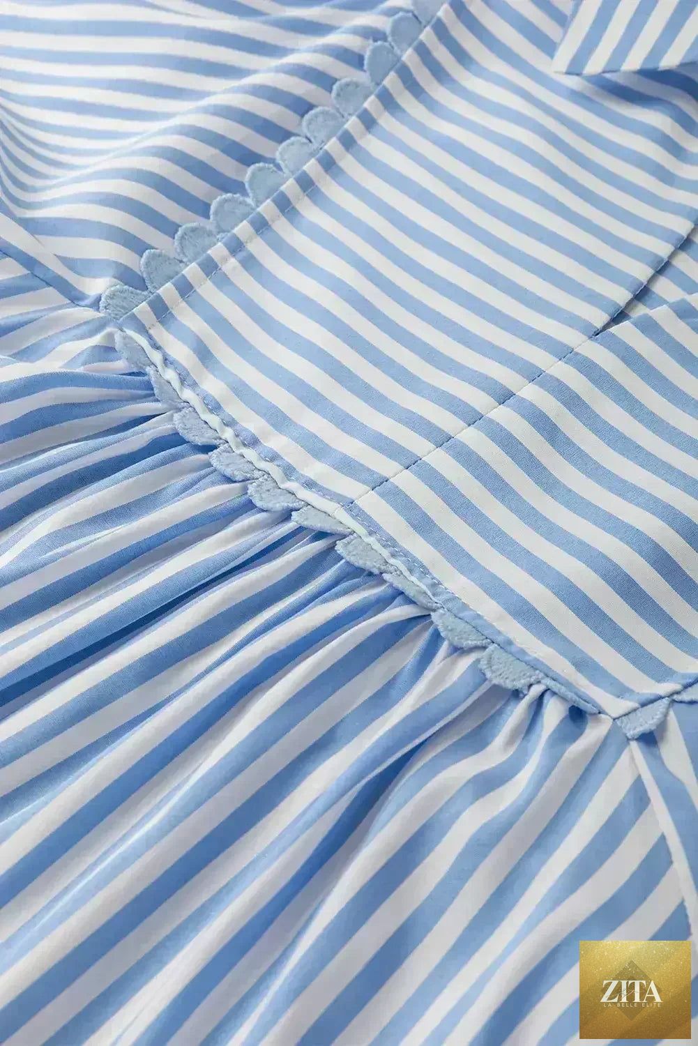Sky blue blouse by Femstylo featuring striped ric rac trim, collared V-neck design, perfect for casual or office wear.