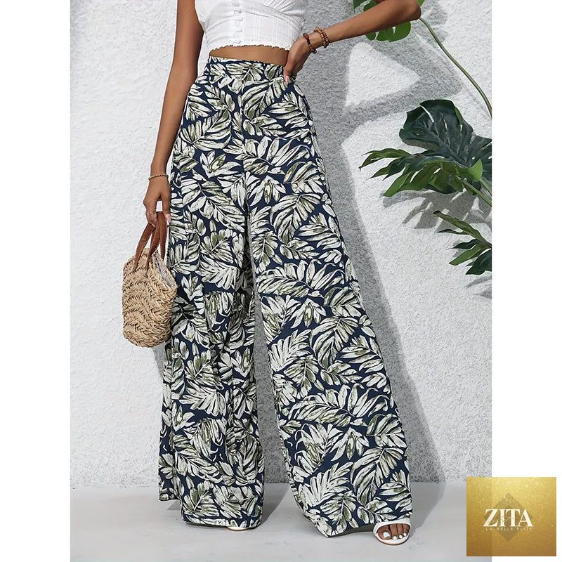 Women’s printed high-waist wide-leg palazzo pants by FitiqueFit, featuring colorful casualwear with a flowy, relaxed fit.