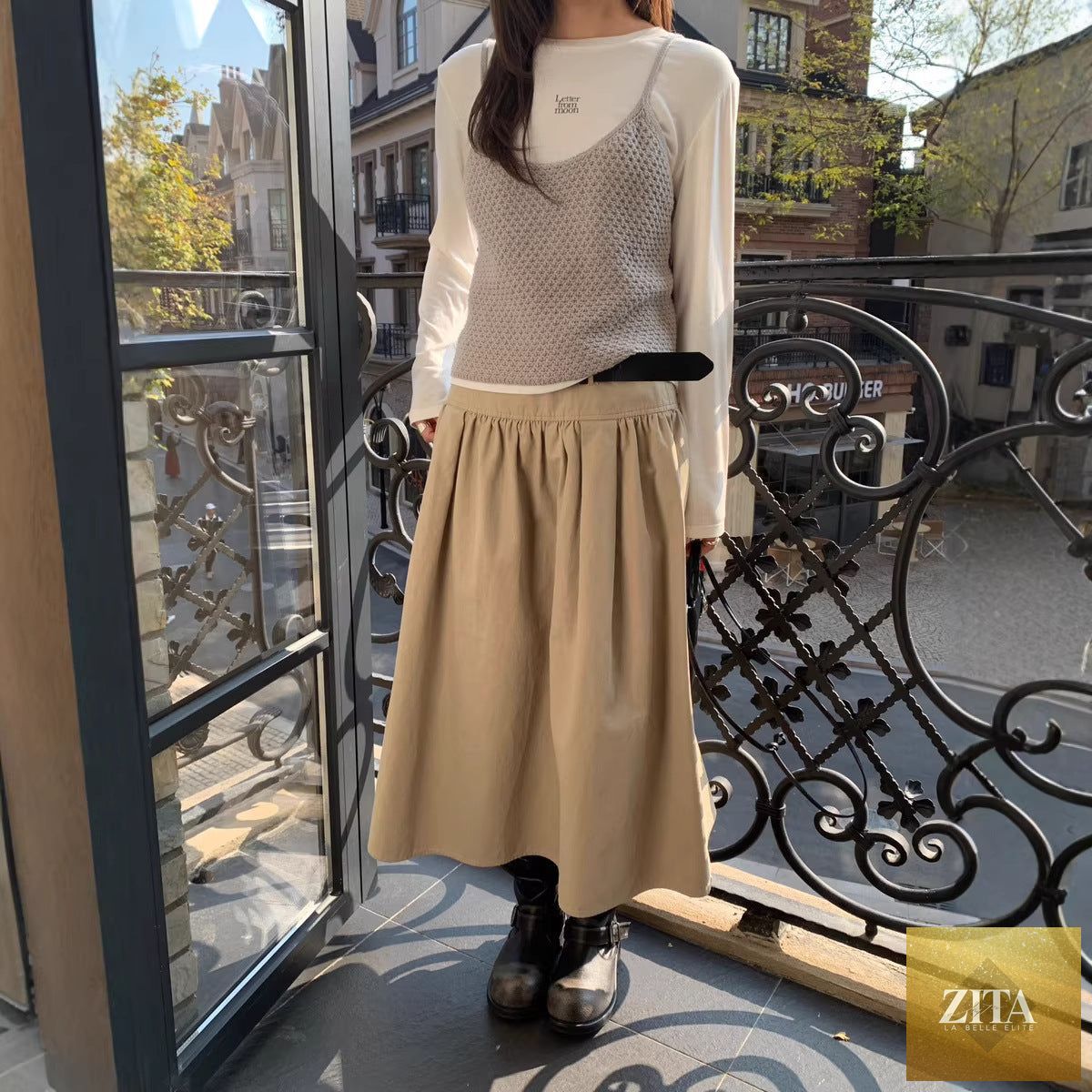 Zita La Belle Elite relaxed A-line crushed pleat cotton midi skirt with belt, casualwear style, shown hanging with belt detail visible.