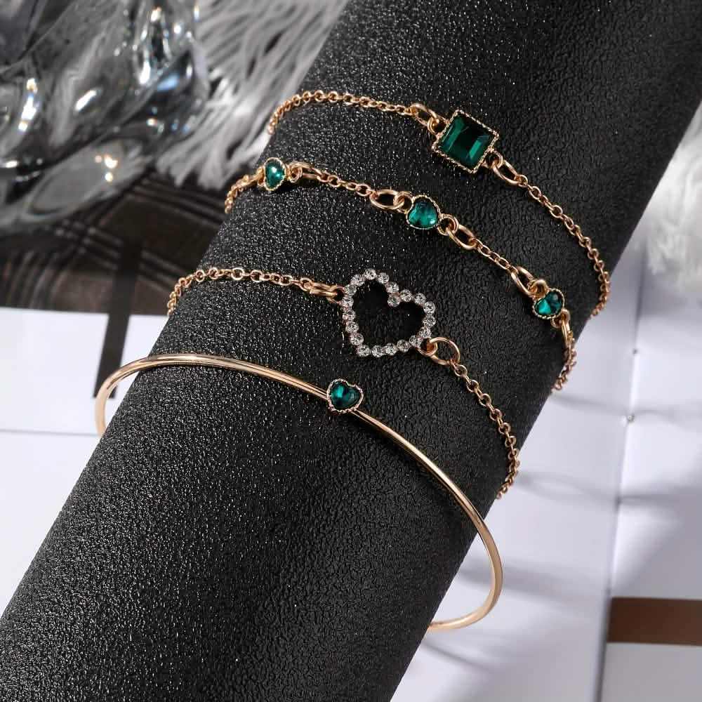 Set of four rhinestone alloy bracelets featuring minimalist heart and square designs, stylish jewelry for women.