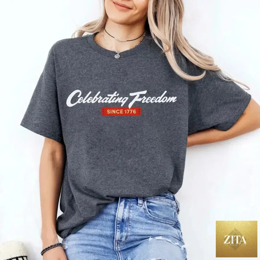 Dark grey 4th of July T-shirt from Adorb Custom Tees with patriotic "Celebrating Freedom Since 1776" design.