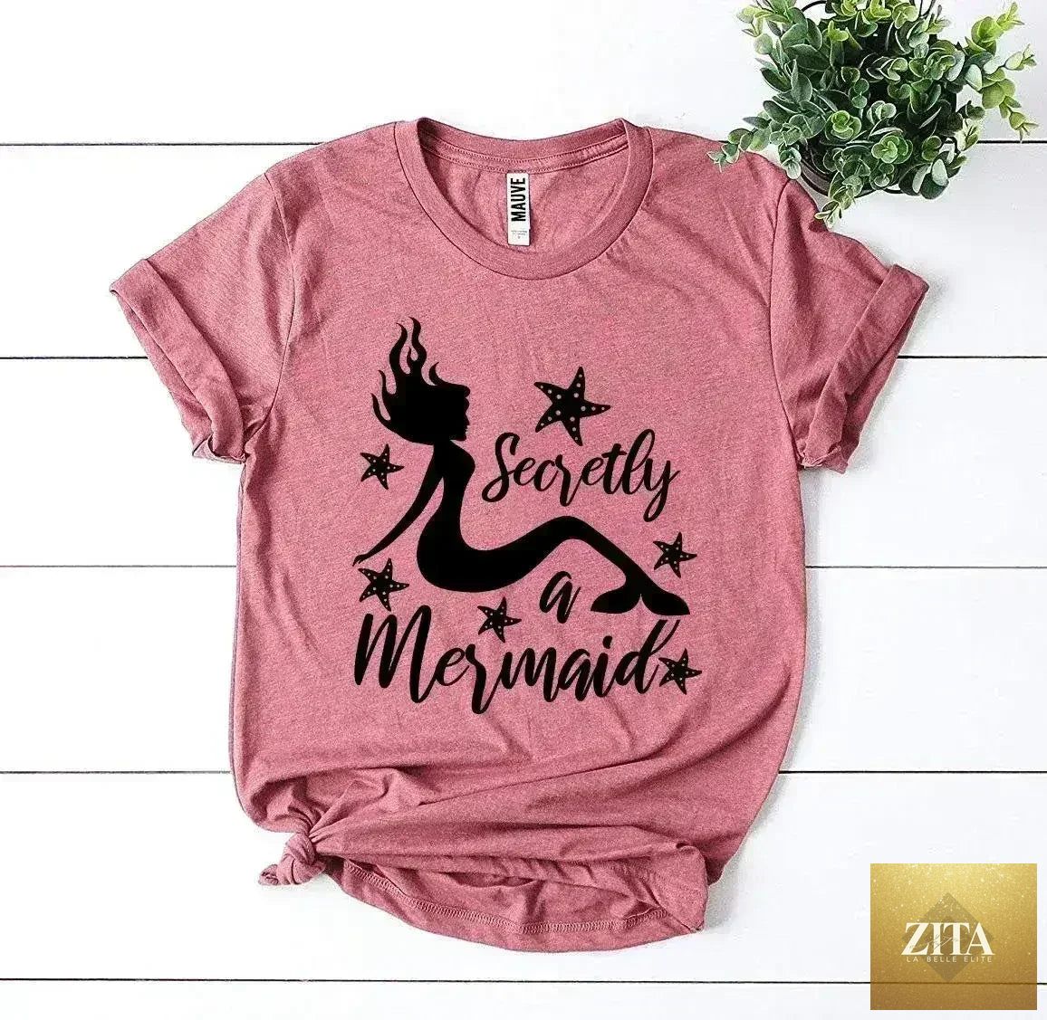 Femstylo "Secretly a Mermaid" T-shirt featuring a playful mermaid graphic on soft cotton fabric.