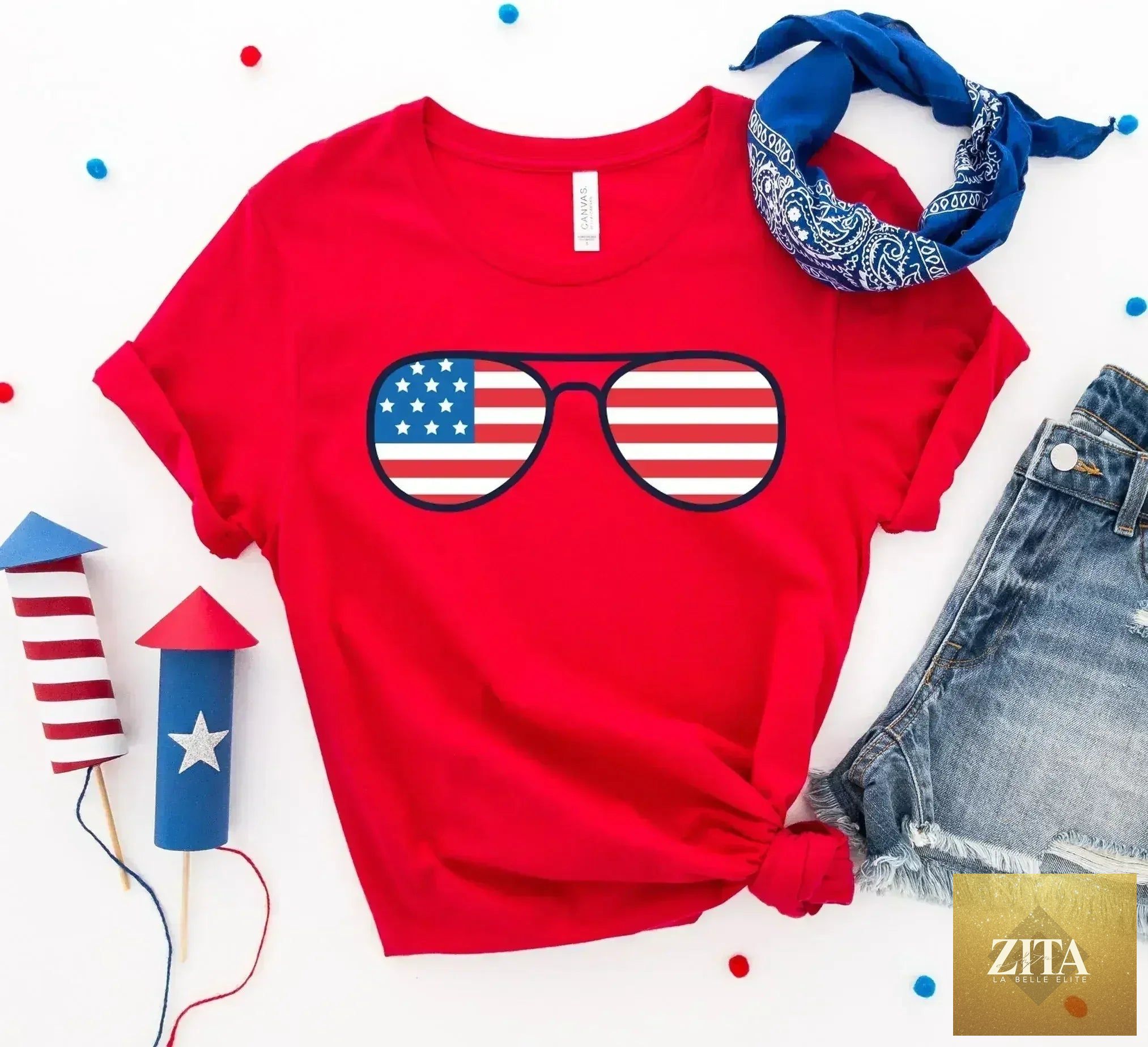 Femstylo American Flag sunglasses T-shirt made of premium cotton, featuring bold flag graphic on a comfortable casual tee.