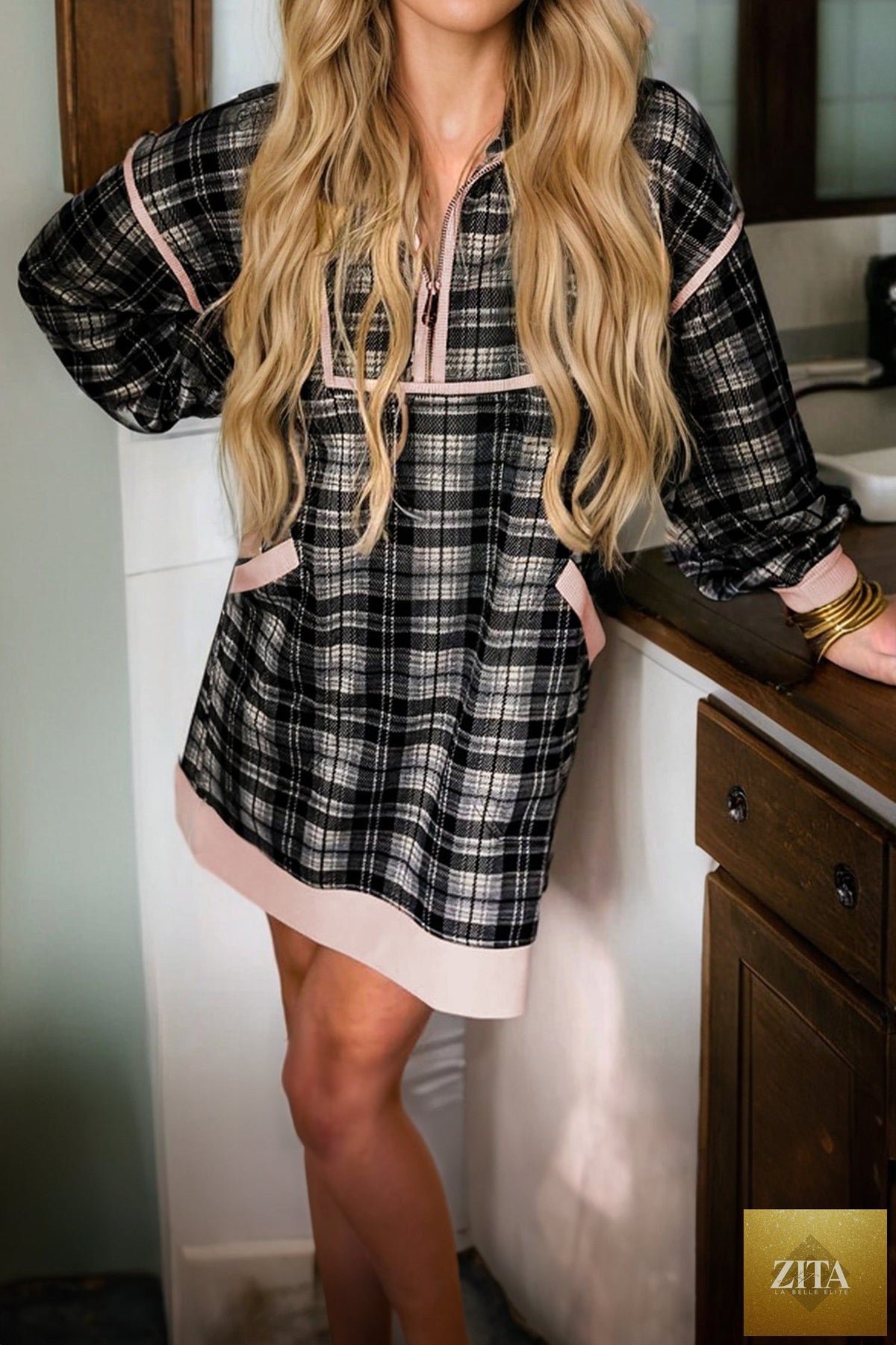 Black plaid mini dress with polo collar, contrast trim, long sleeves, zip-up front, from Wild and Free Boutique.