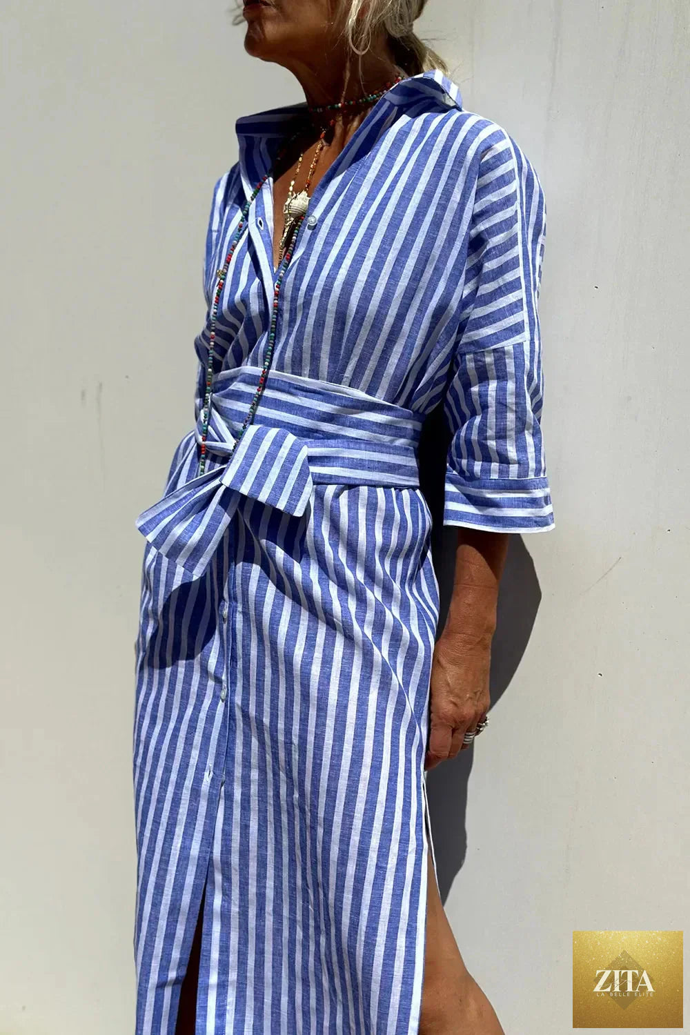 Shopiebay tied button-up three-quarter sleeve dress with a stylish design, featuring a tie detail and elegant sleeve length.