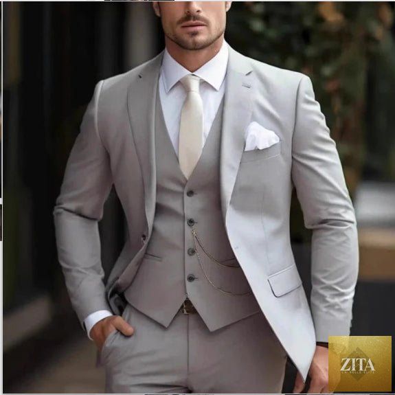 Men's slim-fit light luxury suit by MANDOTOS, shown in deep navy with tailored fit and classic lapel, on a mannequin.