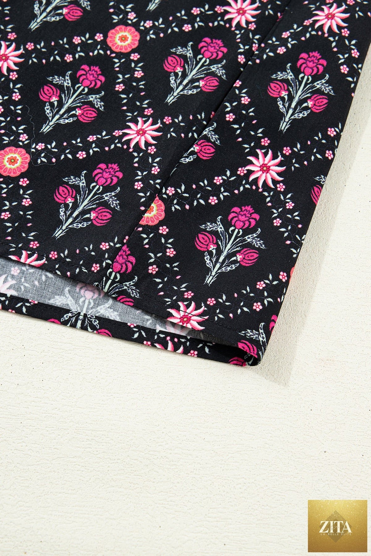 Black contrast V-neckline blouse with bracelet sleeves and vintage floral pattern from Wild and Free Boutique.