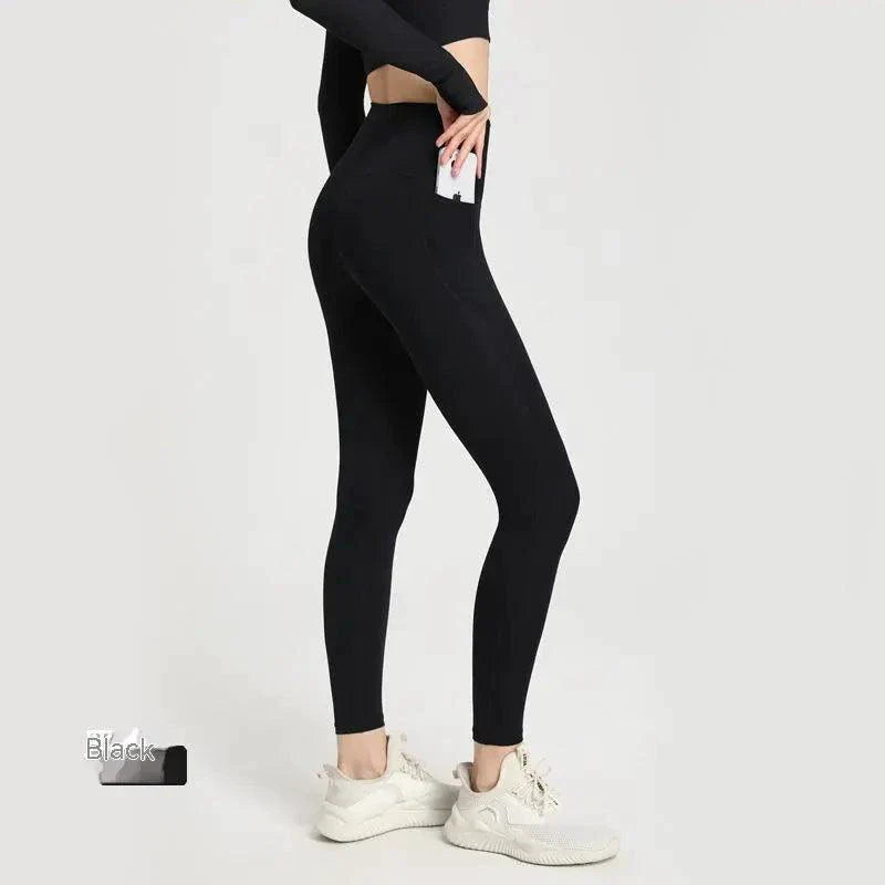 Women’s MANDOTOS Dual-Comfort Athletic Pants with a relaxed fit, elastic waistband, and sporty design for active wear.