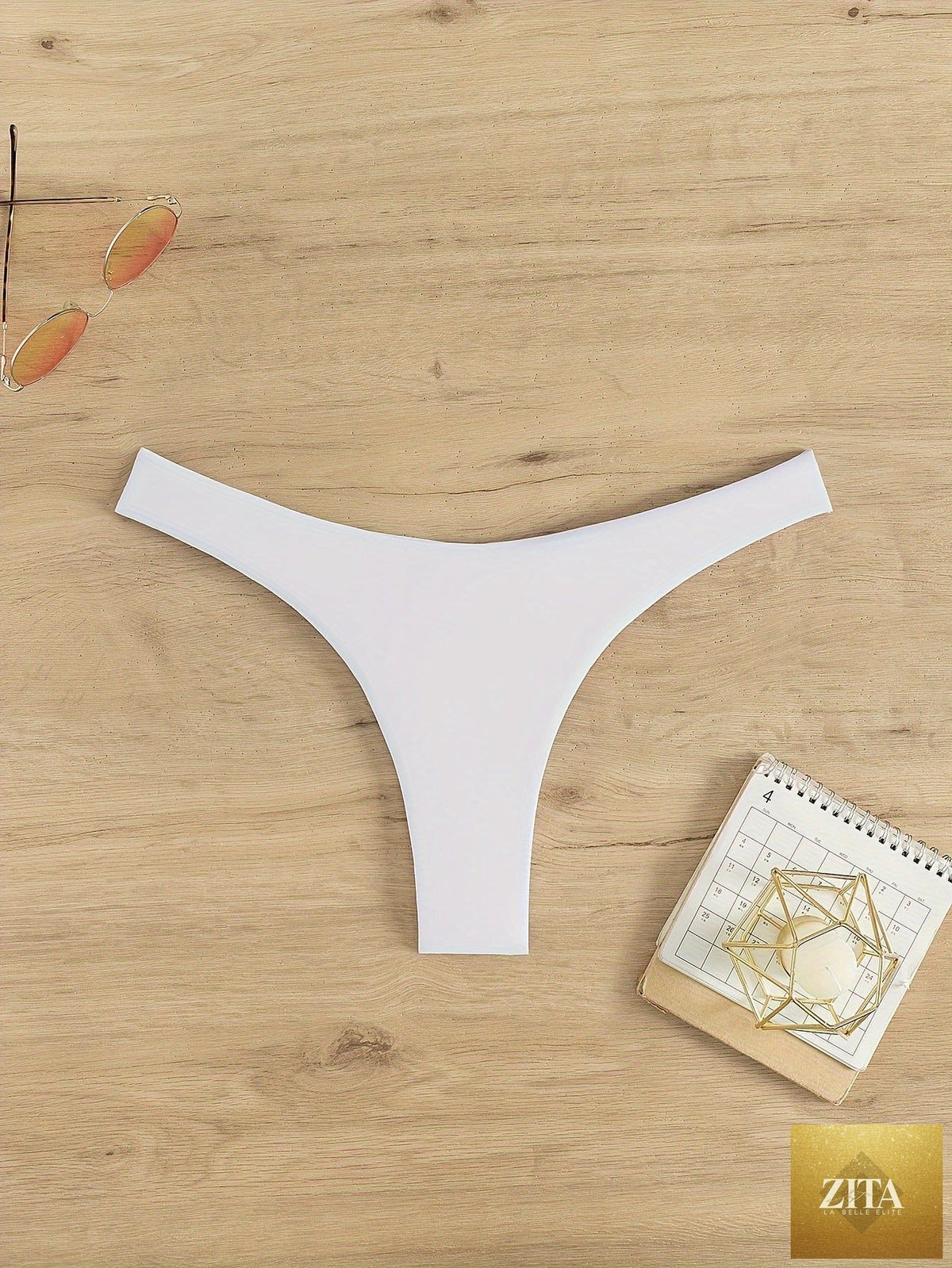 Stevvex solid color cheeky thong bikini bottoms with ruched detail, high stretch polyamide, perfect for beach and summer vacations.