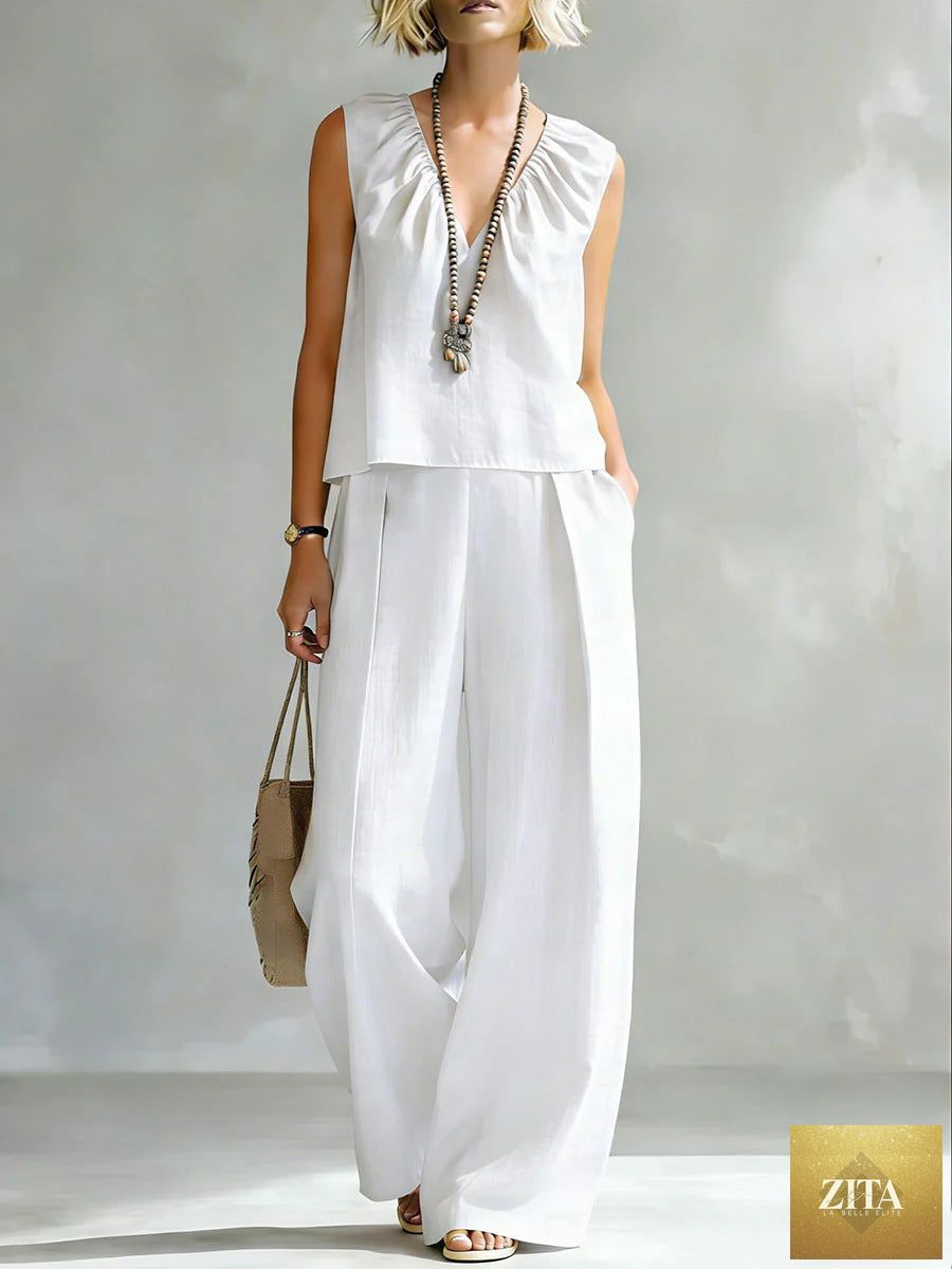 Women's sleeveless cotton-linen shirt and pants set by FitiqueFit, casualwear ensemble with a relaxed, stylish fit in neutral tones.