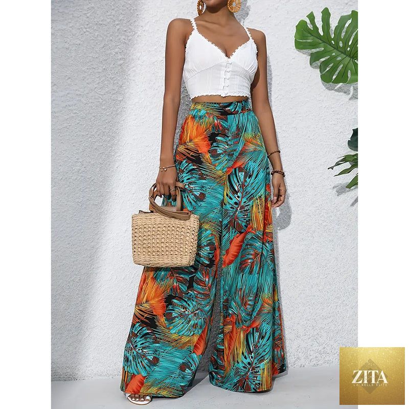 Women’s printed high-waist wide-leg palazzo pants by FitiqueFit, featuring a flowy, casualwear design with colorful floral print.