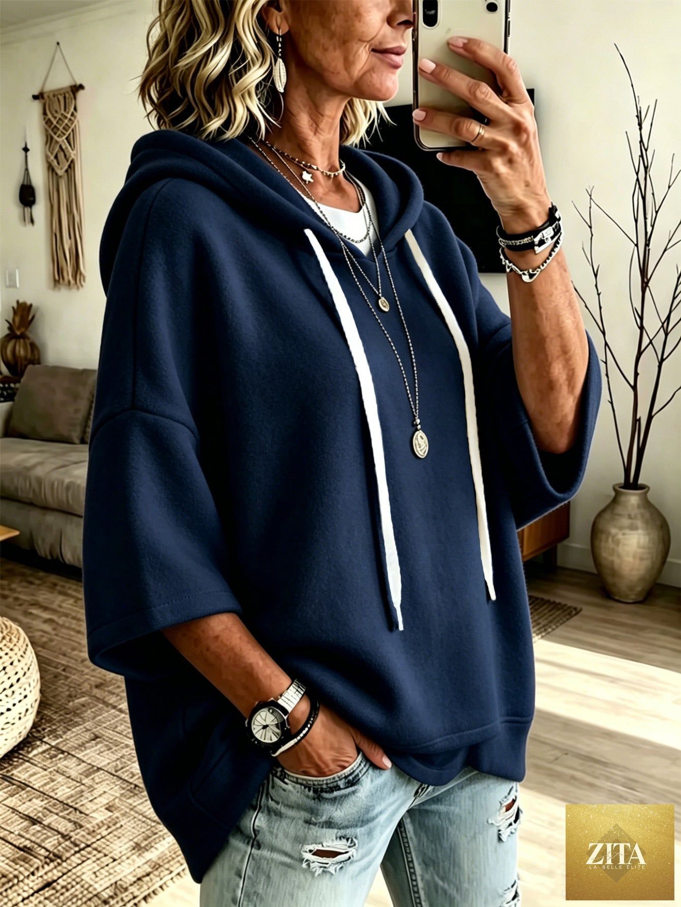 Women's oversized batwing sleeve hoodie by FitiqueFit, loose fleece pullover with relaxed fit and cozy comfort.