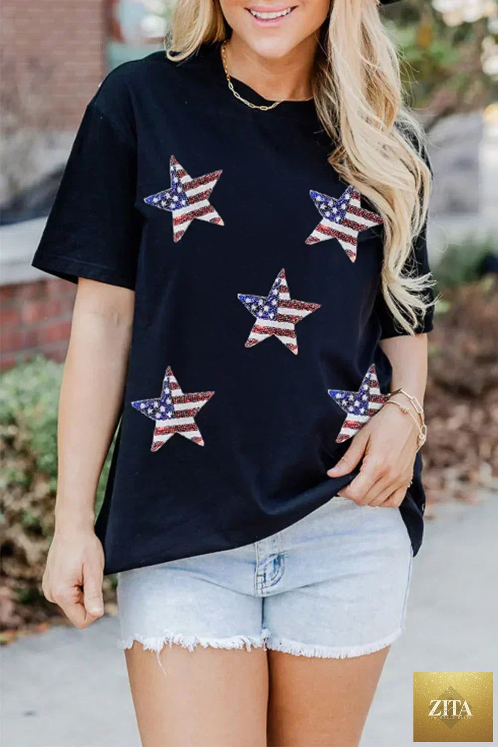 Black sequined American flag star graphic tee by Femstylo, featuring a bold star and flag design on a casual black graphic tee.