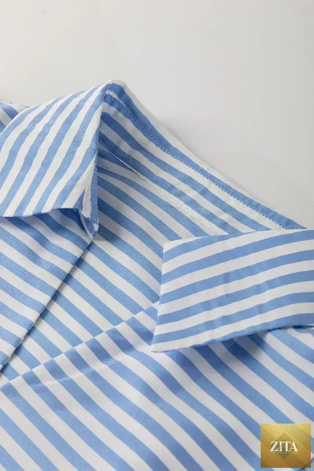 Sky blue striped Ric Rac trim collared V-neck blouse by Femstylo, featuring a stylish design and lightweight fabric.
