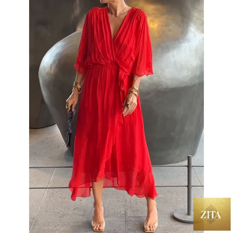 FitiqueFit Batwing Sleeve V-Neck Midi Dress with tied irregular hem, flowing fabric, and elegant style.