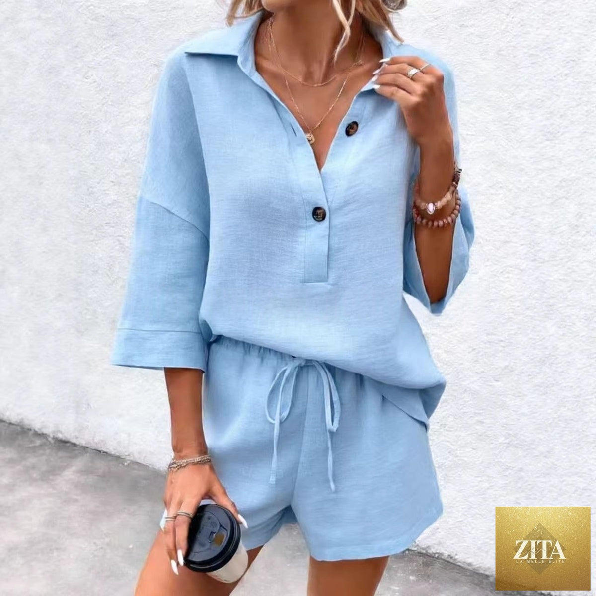 Zita La Belle Elite women's two-piece set with navy notch-lapel short-sleeve top and matching belted shorts, casual and stylish.