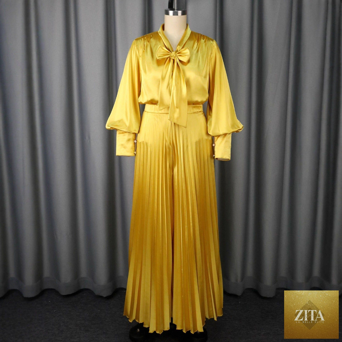 Elegant pleated wide-leg trousers suit featuring a sexy V-neck bow long sleeve top, stylish and sophisticated for formal occasions.