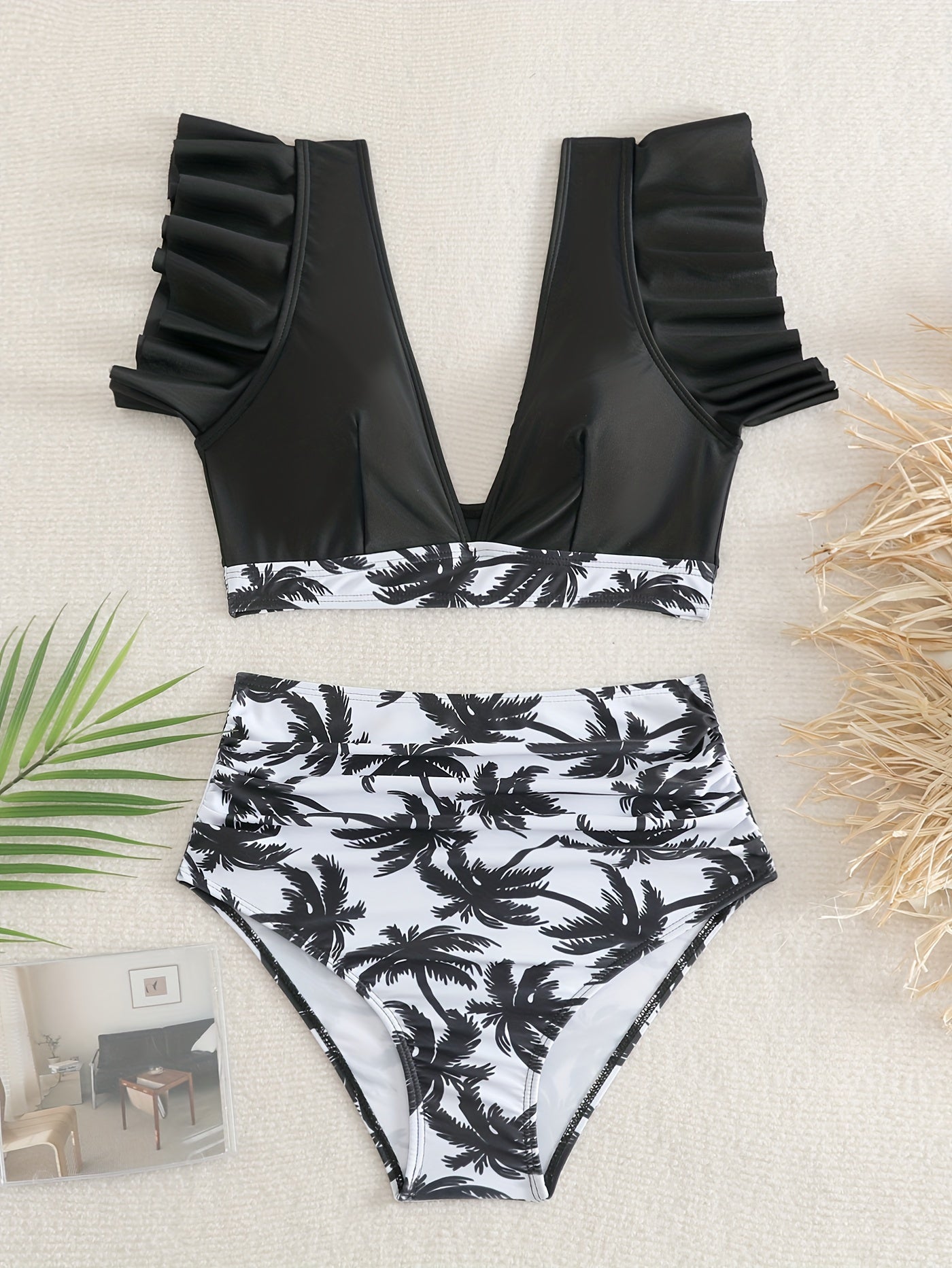 Black solid color ruffle bikini set for women with V neck, high waist, lettuce trim bottoms, made of stretchy fabric for beach and pool.