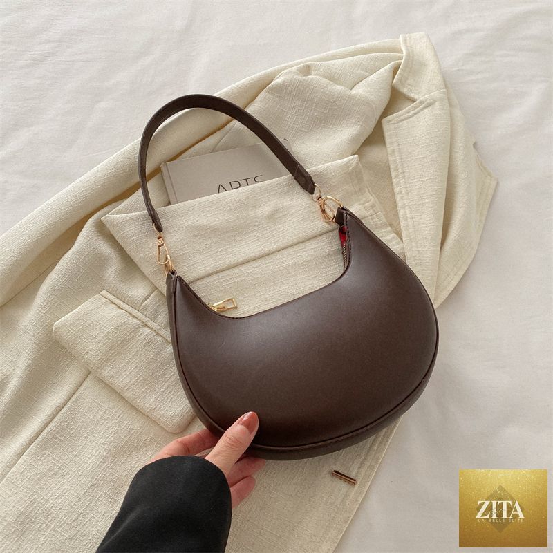 Social Buzz eSIMs Crescent shoulder bag for women, textured all-match design with simple, stylish look and adjustable strap.