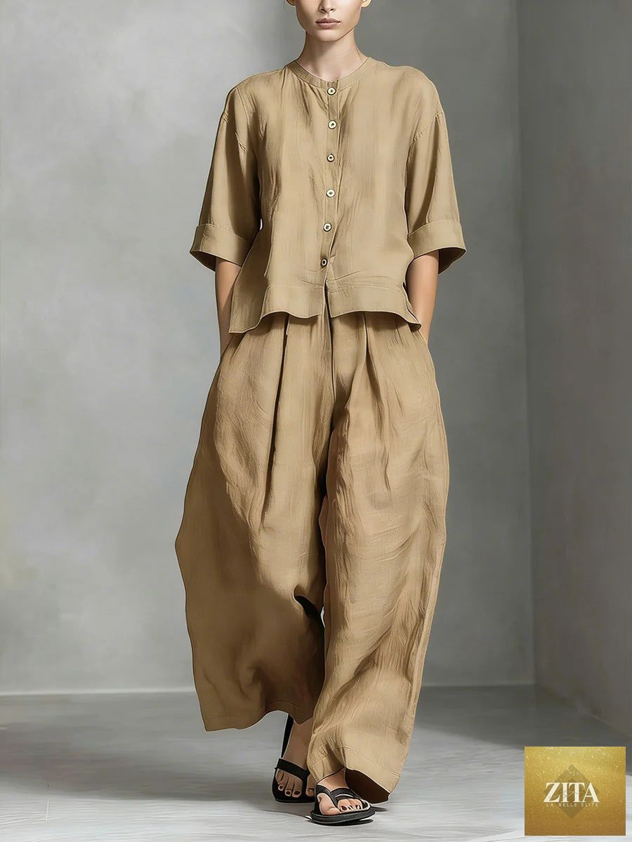 Three-quarter sleeve shirt and loose trousers two-piece set by FitiqueFit, shown in a stylish, casual outfit on a model.