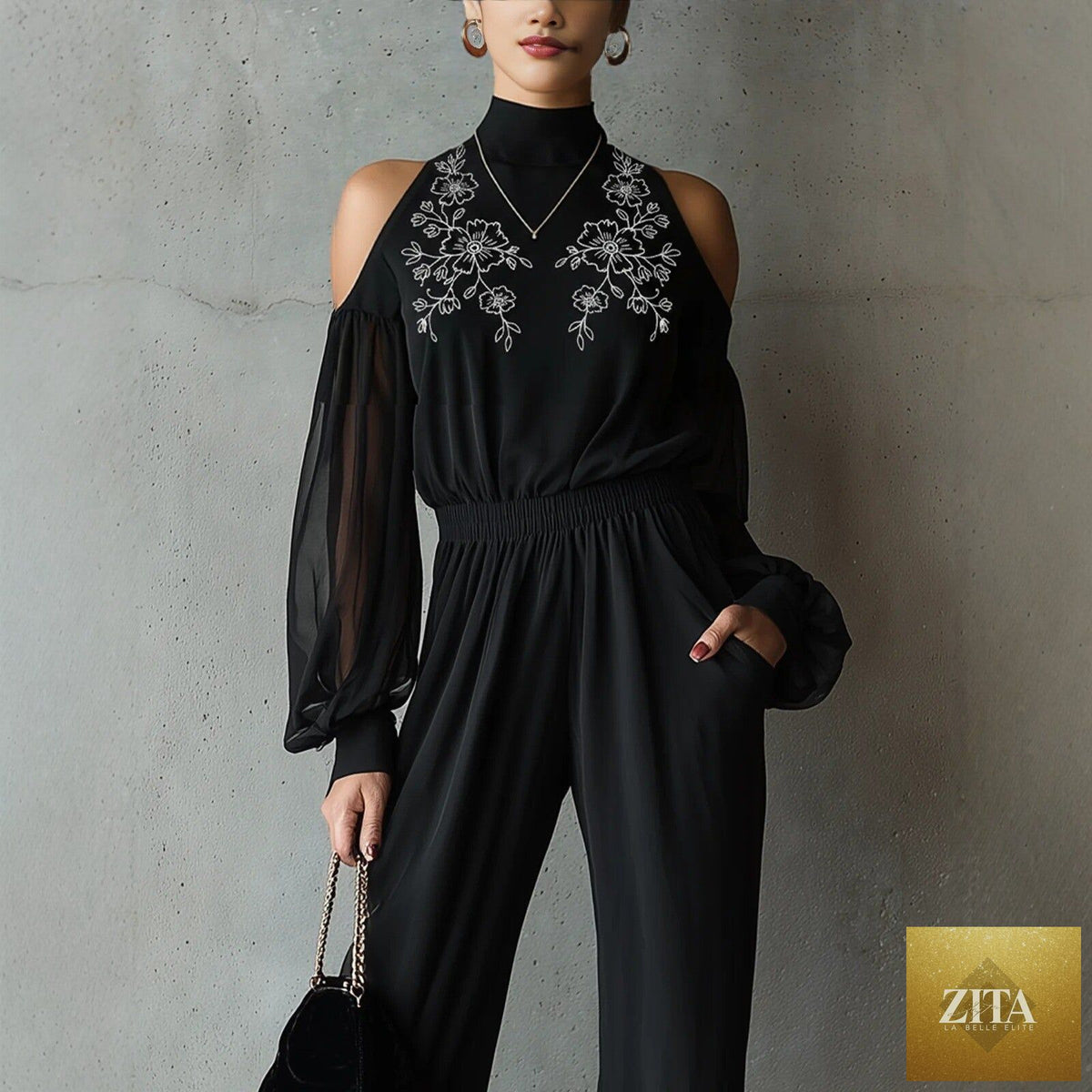 Black embroidered women's long-sleeve wide-leg jumpsuit by Zita La Belle Elite, casualwear with intricate embroidery and flowing wide-leg design.
