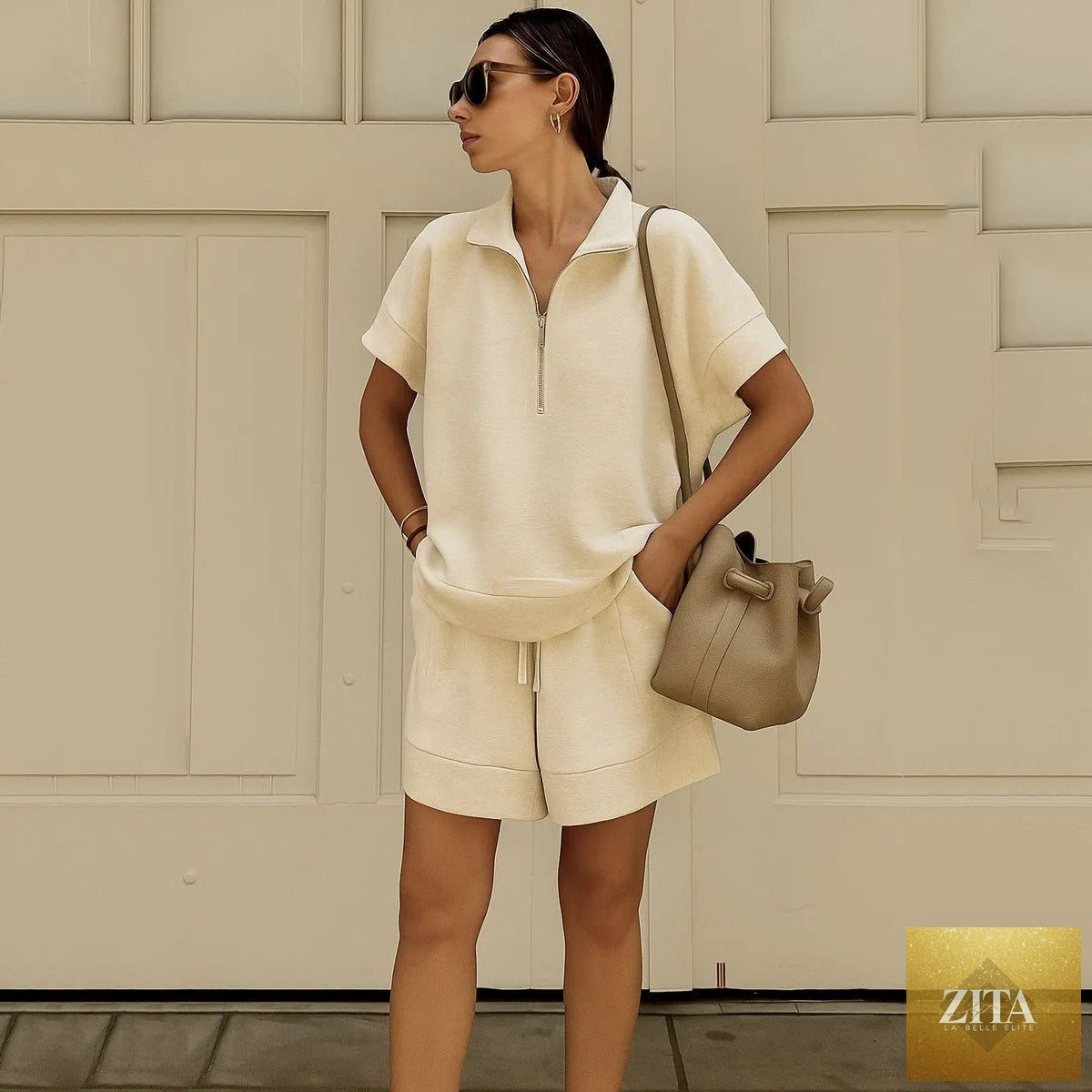 Women’s solid color sweatshirt set by Zita La Belle Elite featuring a casual short top and matching pants.
