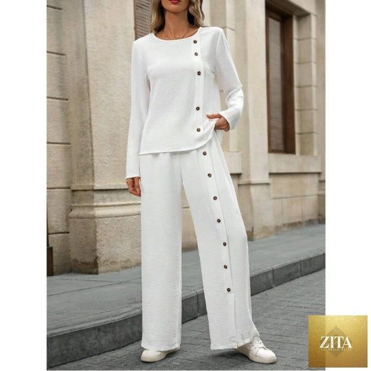 Women’s linen casualwear set by Zita La Belle Elite featuring a button-up top and loose fit two-piece design.