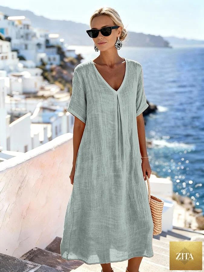 Patchwork asymmetrical maxi dress by FitiqueFit featuring a relaxed V-neck style and a flowing, colorful design.