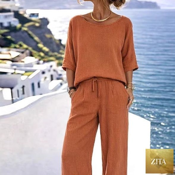 Women's cotton linen resort set by Zita La Belle Elite featuring a short sleeve top and wide-leg pants in a relaxed style.