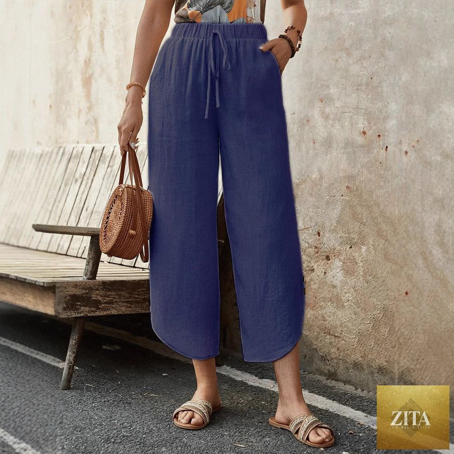 Women's cotton-linen cropped drawstring casual pants by FitiqueFit, featuring a relaxed fit and adjustable waist, light and breathable fabric.