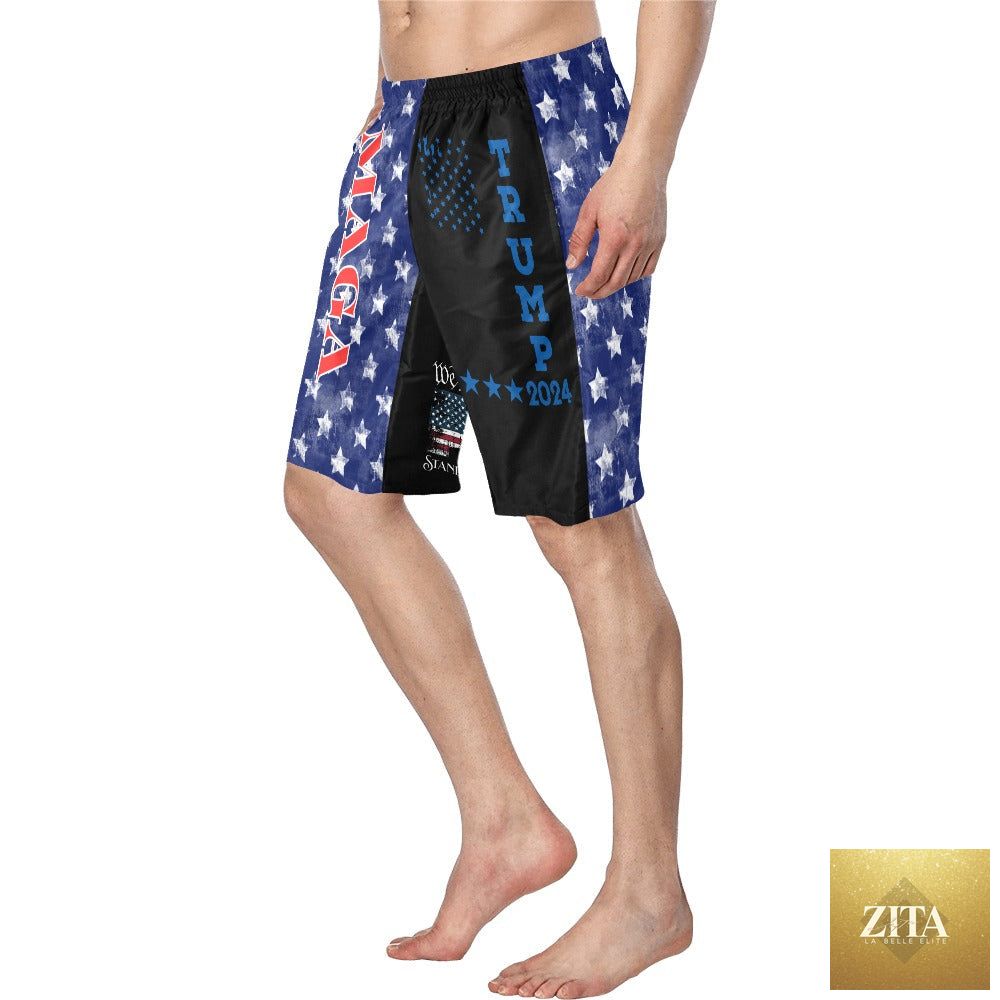 We the People Trump MAGA swim trunks, summer beach shorts with patriotic print, by Baha Ranch Western Wear, on a sandy beach.