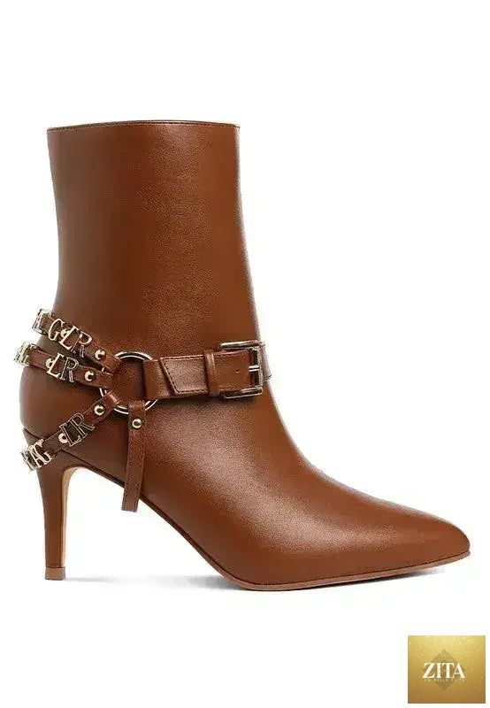 Femstylo buckle harness stiletto boots with 3-inch heels, featuring black leather with buckle detail and sleek silhouette.