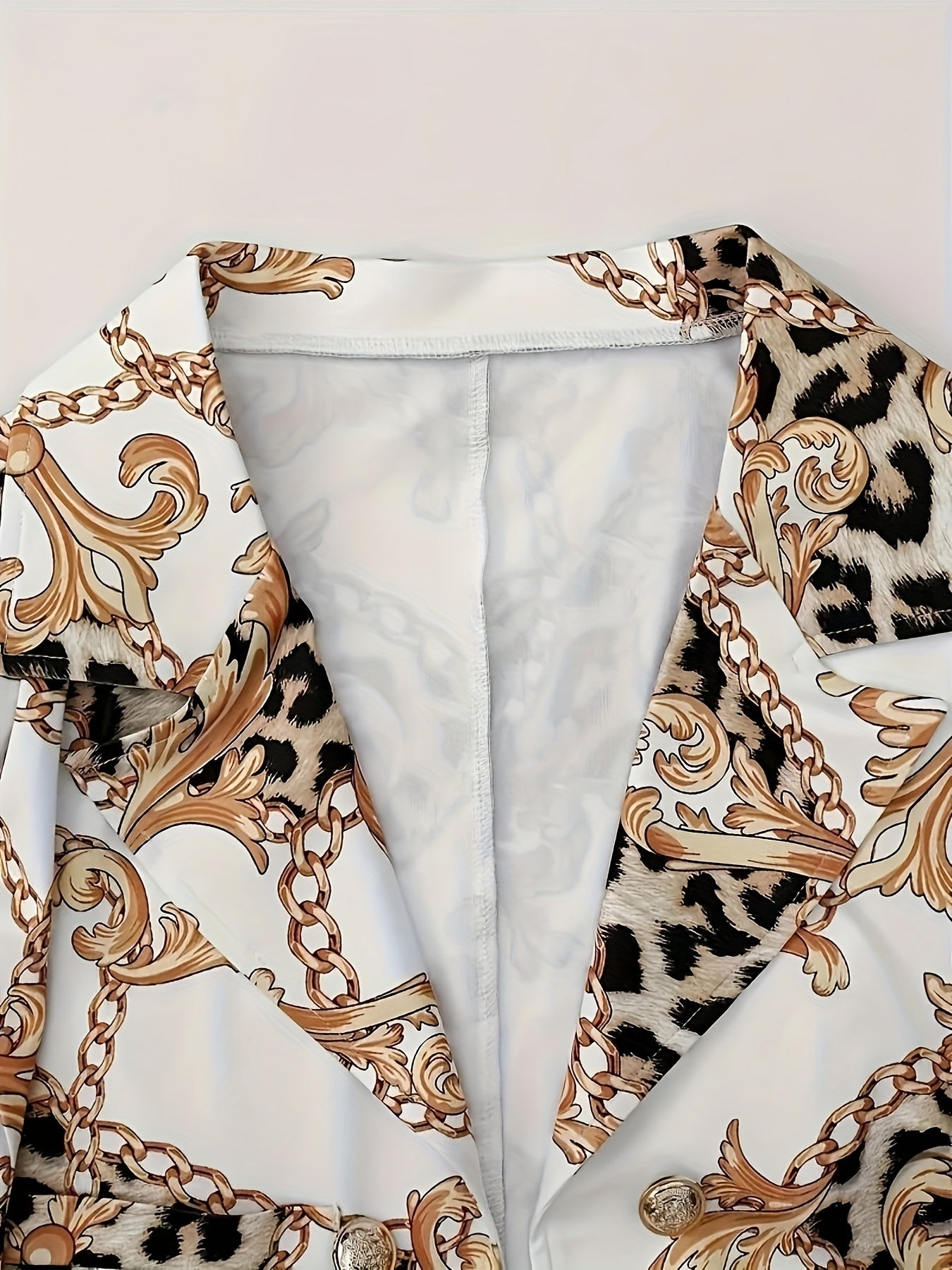 FitiqueFit geometric print two-piece blazer set for casualwear, featuring a stylish blazer and matching pants with bold geometric patterns.
