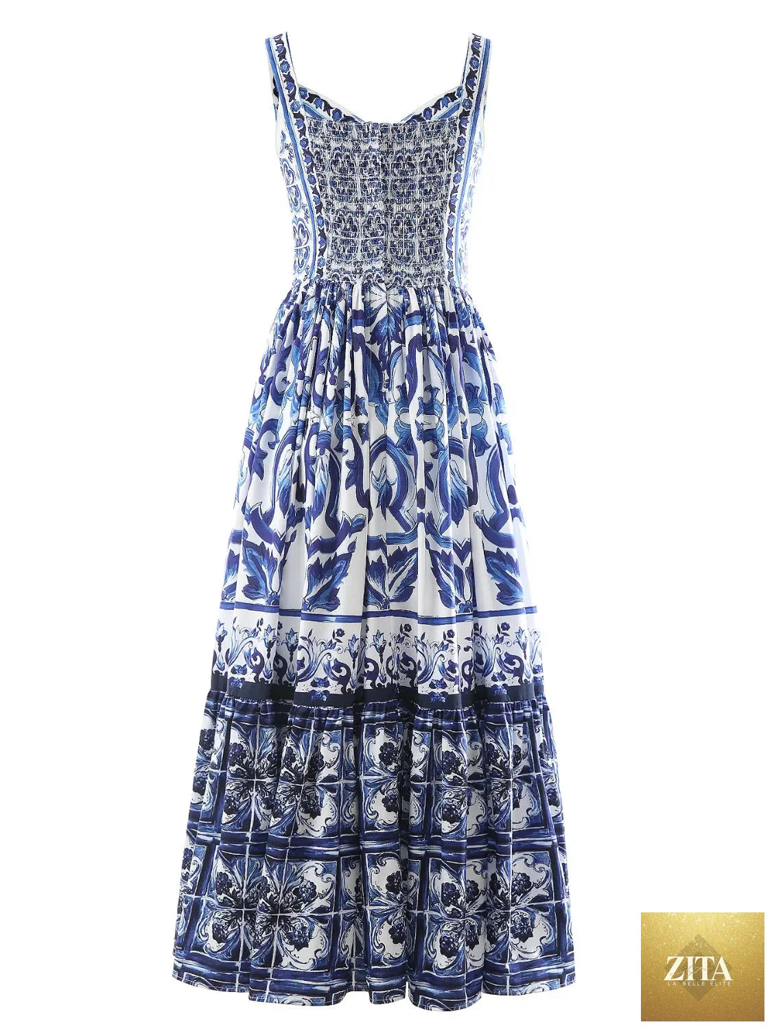 Smocked printed wide strap dress by Shopiebay featuring floral patterns and a relaxed fit, perfect for casual summer wear.