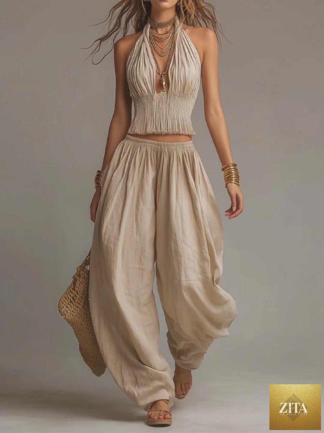 Women's sleeveless backless halter top and wide-leg pants set by Zita La Belle Elite, styled together in a fashionable outfit.
